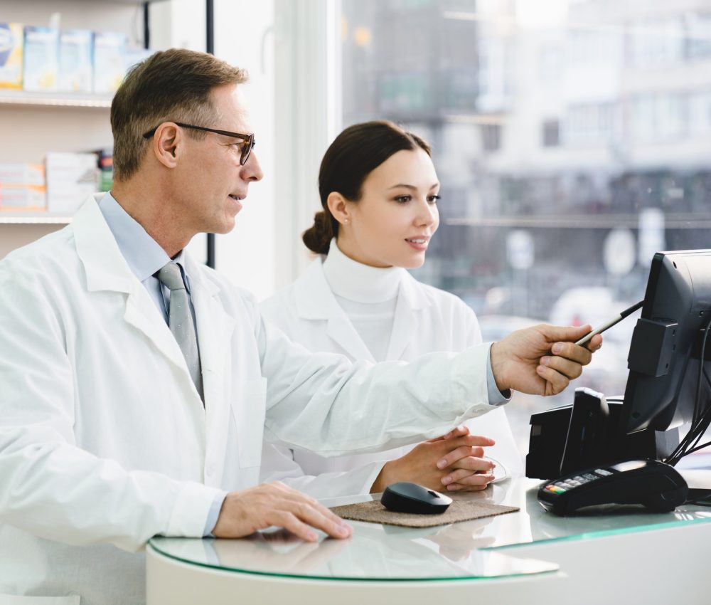 pharmacist-pointing-showing-male-colleague-medication-prices-prescriptions-on-computer-screen.jpg pharmacist-pointing-showing-male-colleague-medication-prices-prescriptions-on-computer-screen.jpg